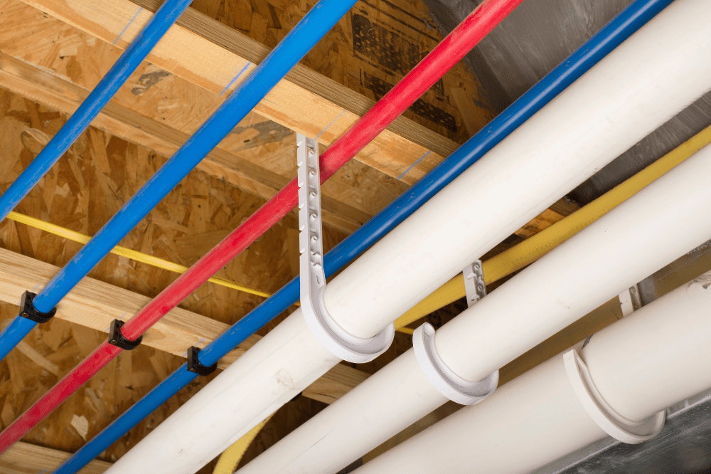 A close-up of a PEX piping system in a home's plumbing.